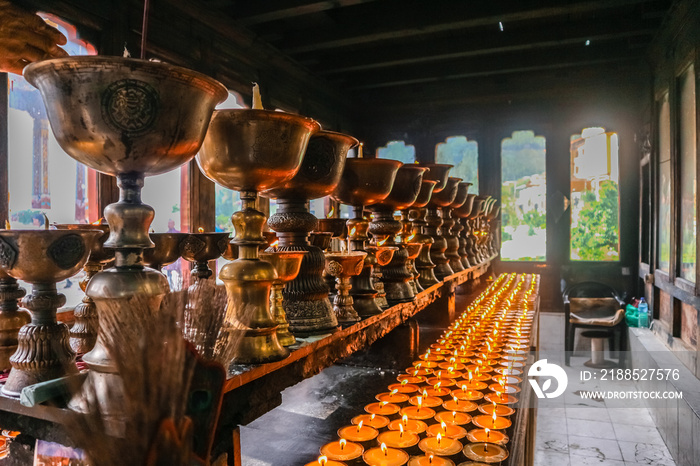 Lighting of praying candles in Zangdhopelri Monastery in Thimphu, Bhutan