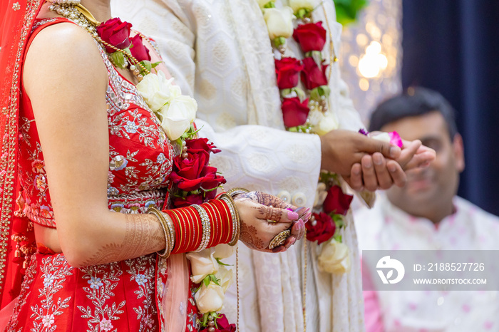 Indian Hindu wedding ceremony rituals bride and groom’s hands close up