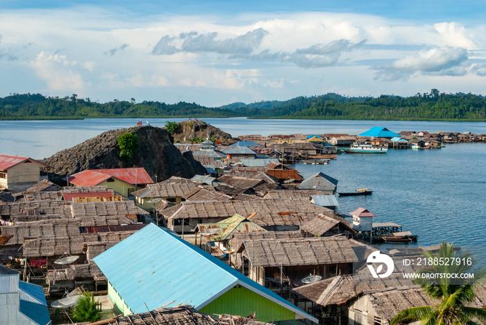 Bajau village built on the wooden poles in the shallow waters of Molluca sea, Sulawesi, Indonesia