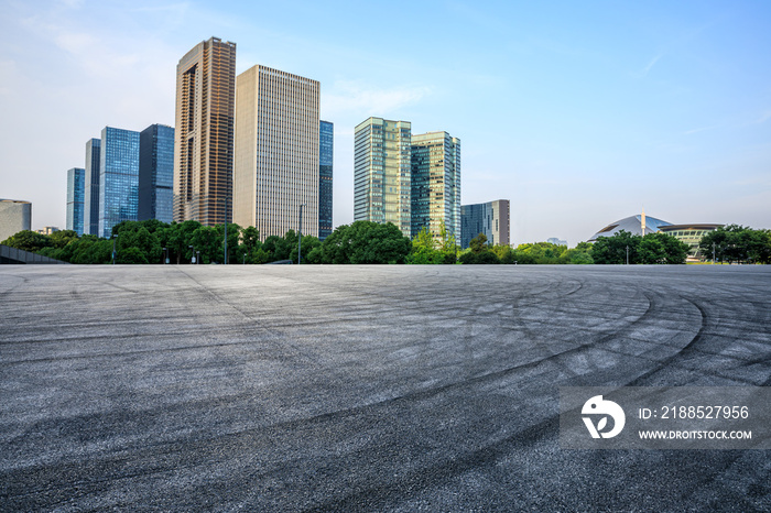 Asphalt road and modern city skyline with commercial buildings in Hangzhou, China. Road and modern buildings background.