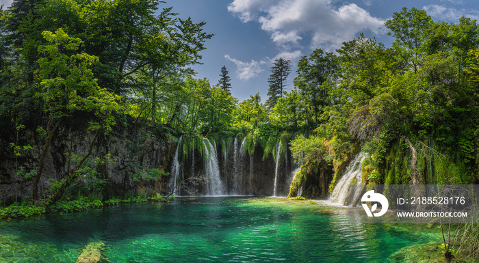Amazing panorama with waterfall, water coming down from lichens to turquoise coloured lake. Plitvice Lakes National Park UNESCO World Heritage Croatia