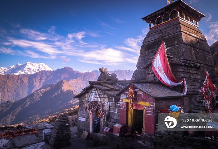 Beautiful panoramic landscape view of the Lord Shiva temple at the highest altitude of Himalaya. Snow-capped mountains from Chandrashila peak in Chopta, Uttarakhand, India,.