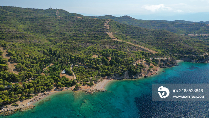 Aerial drone photo of secluded beaches in Ligoneri area near old town of Spetses island, Saronic gulf, Greece