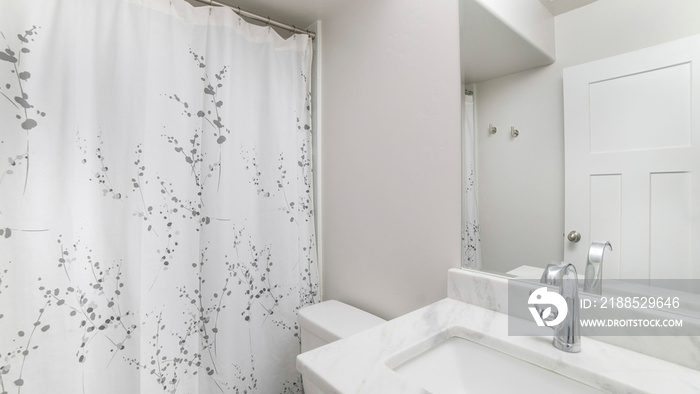 Pano Interior of a bathroom with white sink marble top and mirror