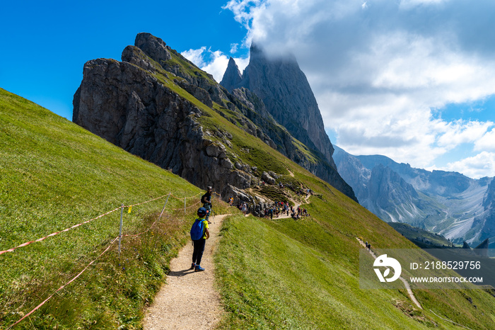 Hikers on the slopes of Mount Seceda. Val Gardena Italy