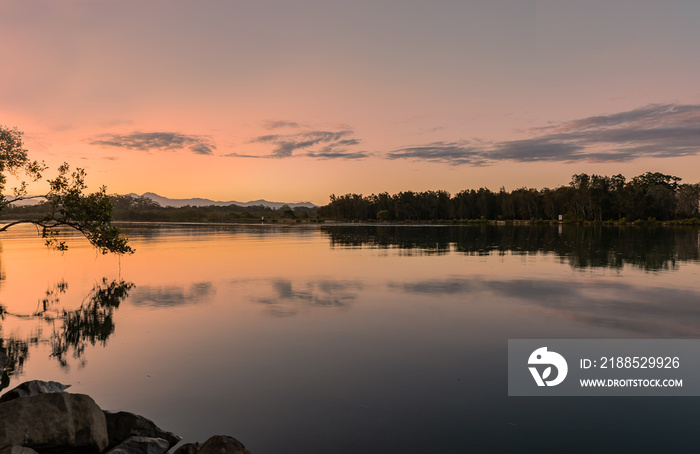 Landscape evening view golden sunset over the river with beautiful seen and background. Beauty and nature concept. Coffs Harbour’s, Australia.