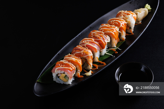 Salmon Sushi roll Japanese food isolated in black background