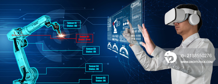 Engineer controls robotic arms by augmented reality industry technology application software. Smart robot machine in future factory working in concept of Industry 4.0 or 4th industrial revolution.