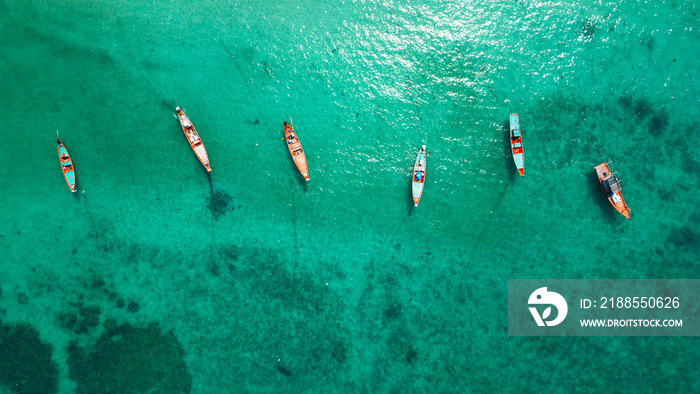 Aerial view of longtail boats from the sky.