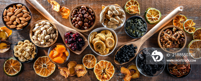 Composition with a variety of dried fruits and assorted nuts.