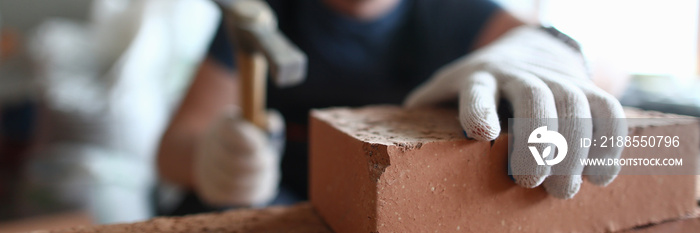 Professional bricklayer working on construction