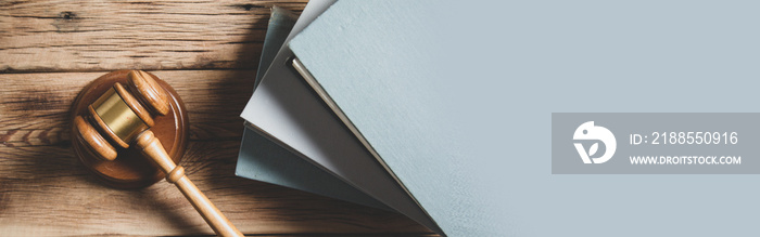 wooden gavel and books on wooden table