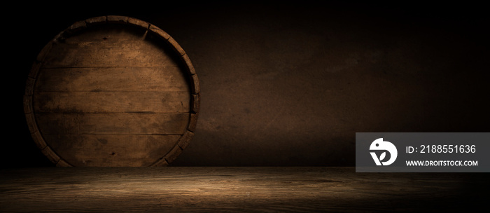 Wooden barrel on a table and textured background