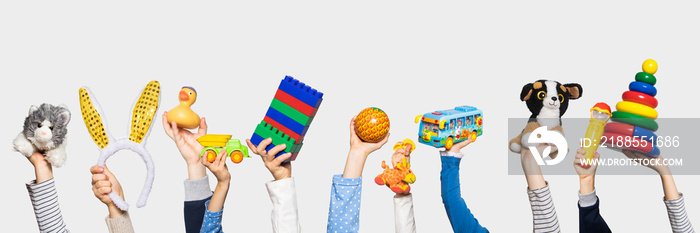 Toys in the hands on white background