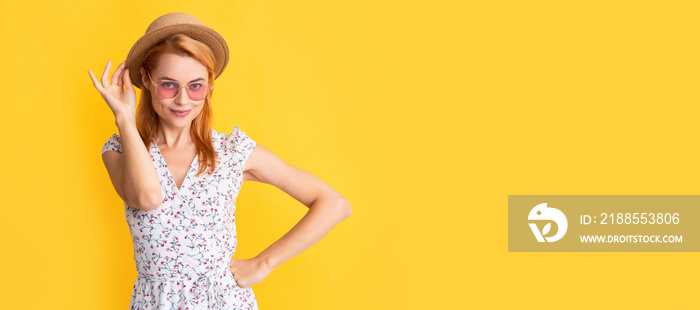 Woman isolated face portrait, banner with copy space background. smiling woman in straw hat and sunglasses on yellow.