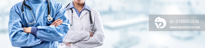 Young couple of surgeon and doctor in front of blurred the interior of the operating room or clinic