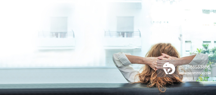 woman resting on the sofa at home with space