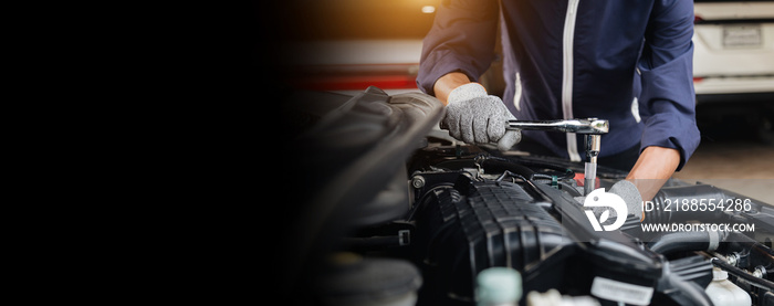 Automobile mechanic repairman hands repairing a car engine automotive workshop with a wrench, car service and maintenance,Repair service.