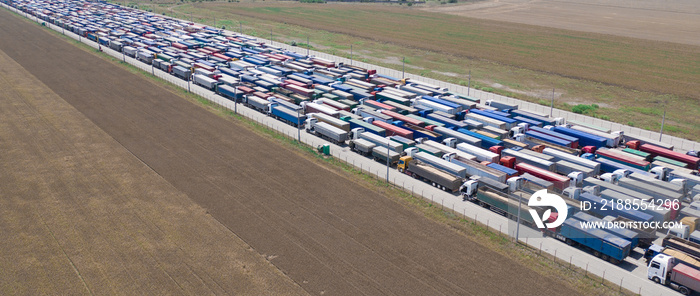 Trucks stand in line to the terminal.