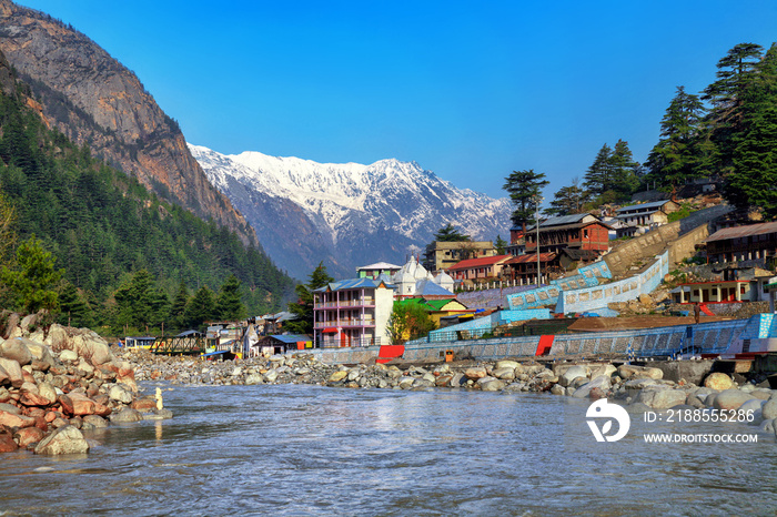 View of Gangotri town with mountains and holy ganga river. Uttarakhand, India.