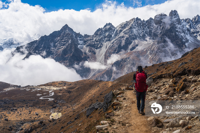 A man walking to Lumde village after cross Renjo la pass, Everest region in Himalaya mountains, Nepal