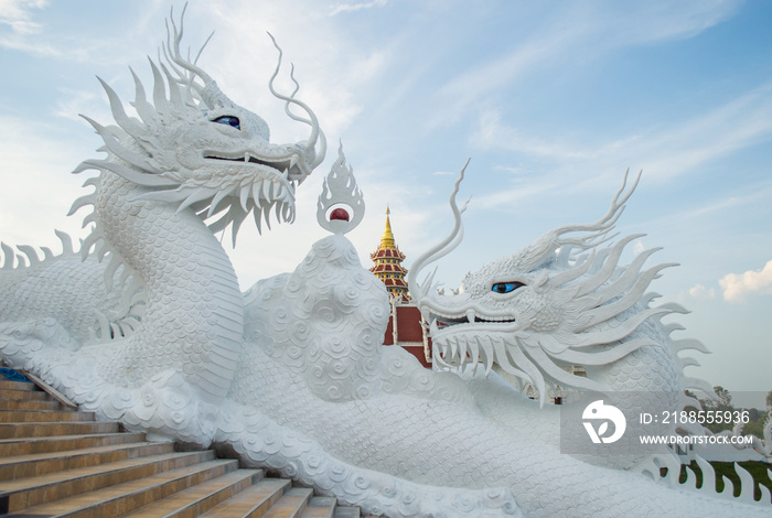 The beautiful twin Chinese dragon sculpture of Wat Huay Pla Kung temple in Chiang Rai province of Thailand.