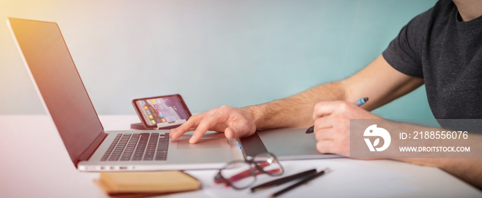 Graphic designer working using laptop