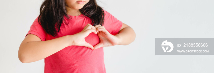 Asian child’s hands gesture in heart shape showing love and kindness. Concept of Health care, Charity, Organ Donation, Generous, Pleasure, Hope, Love, Trust, World heart.isolated.self esteem.heart day