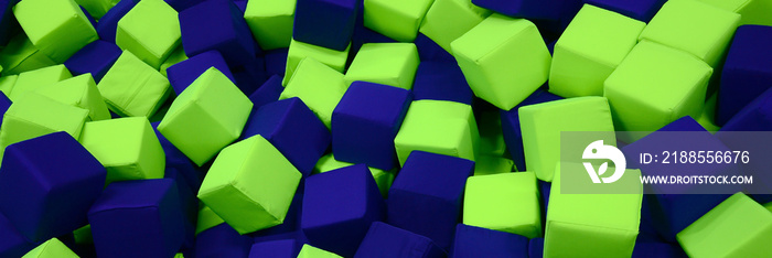 Many colorful soft blocks in a kids’ ballpit at a playground