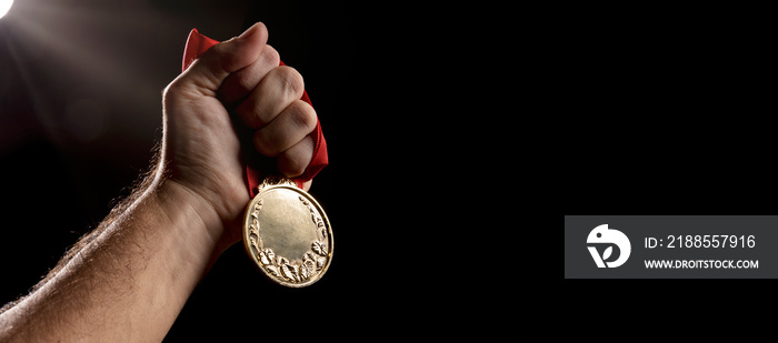 Gold medal on black background