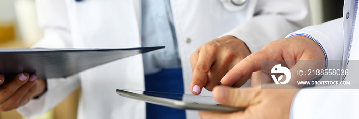 Two doctors looking in tablet pc display