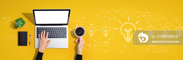 Idea light bulb theme with person using a laptop computer