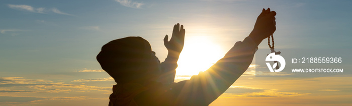 The human hand raises his palm open to worship. Eucharist, bless the Lord, help Catholics repent of Easter. behind the concept of Christianity Battle and Victory for God