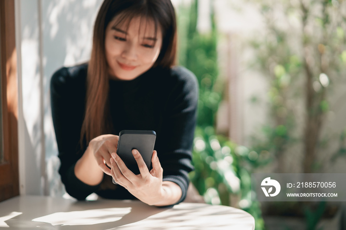 Asian working woman hold mobile phone text message, chat conversation, using social media. Businessw