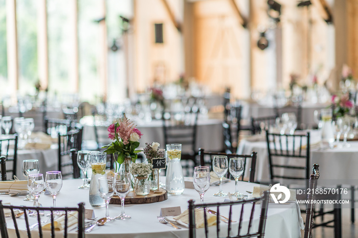 wedding table set up decoration with flowers and glasses