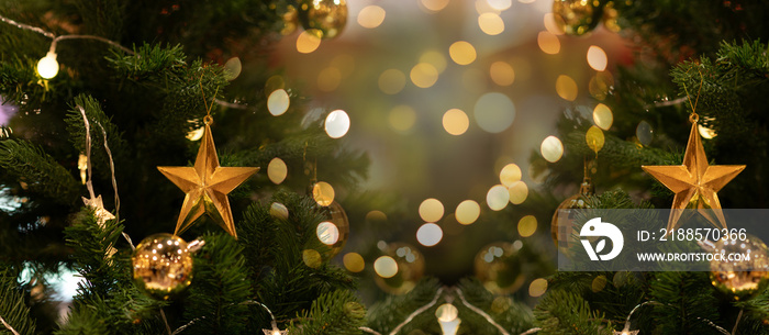 Focus on the Christmas tree star lights and bokeh near the Christmas fireplace.