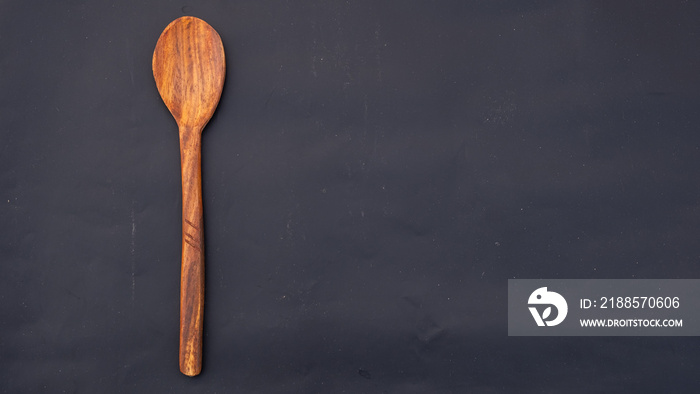 wooden utensils. wooden spoon. wooden vintage. spoon. Wooden spoon on a blue background with copy sp