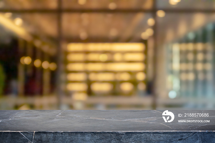 Empty black marble stone table top and blur glass window interior restaurant banner mock up abstract