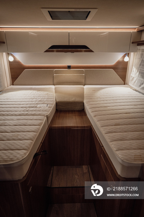 Image of the bed inside a new luxury camper van motorhome.