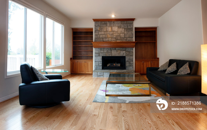 Family room remodeled with solid red oak wooden floors and new furniture