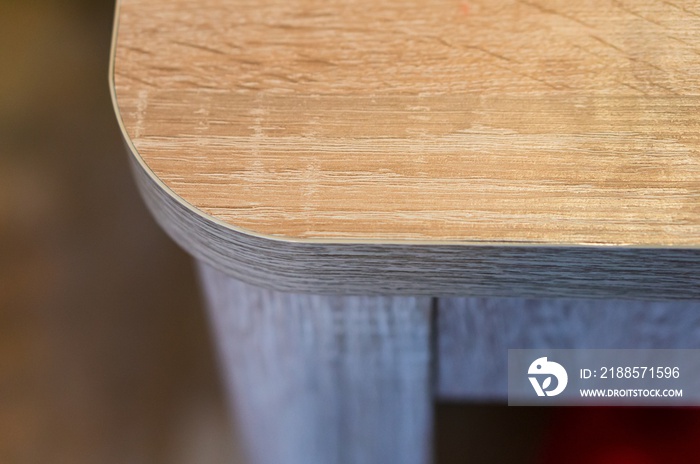 Closeup shot of a wooden counter edge