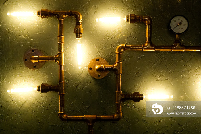 Modern led light made from water pipes. Rustic design, stucco wall with light bulbs and pipes