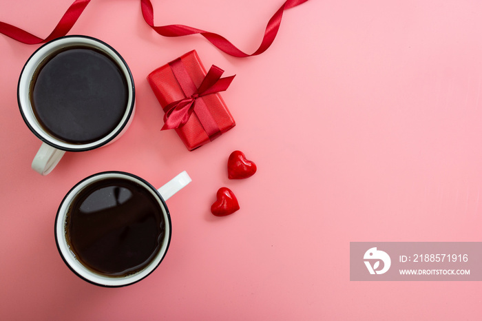 Valentines day pink background. Flat lay view of two cups and red gift box, hearts, mock up with co