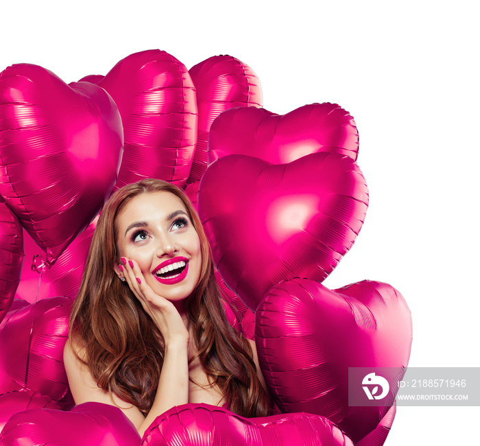 Happy surprised woman with bright pink heart balloons isolated on white background