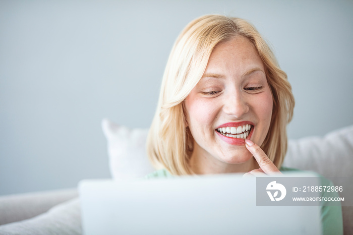 Woman speaking with dentist in modern living room in sunny day. Woman  with toothache speaking with 