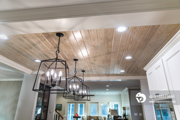 Hanging black metal iron lighting fixtures in a newly renovated kitchen