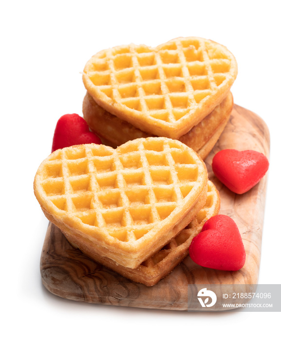 Stacks of heart shaped waffles isolated on white