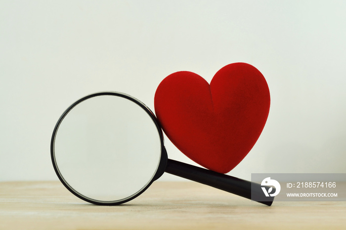 Heart with magnifying glass - Concept of searching love