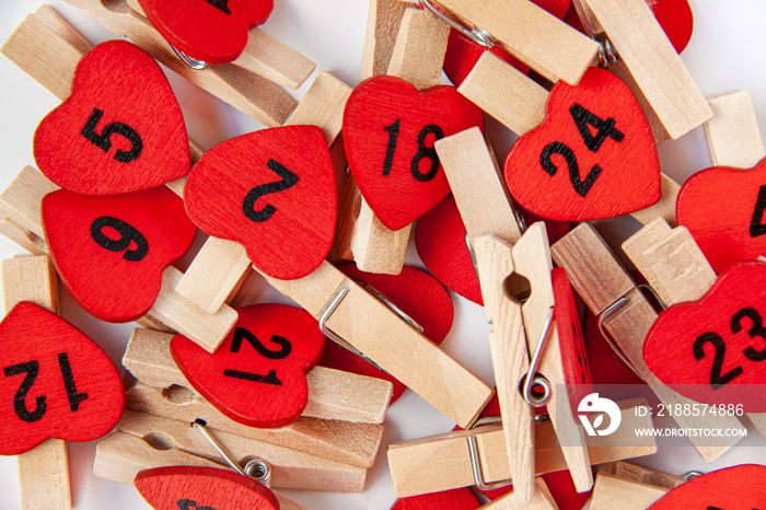 Advent calender numbers on red hearts. Christmas concept. Valentines day on white background.