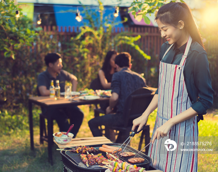 Asian woman are cooking for a group of friends to eat barbecue